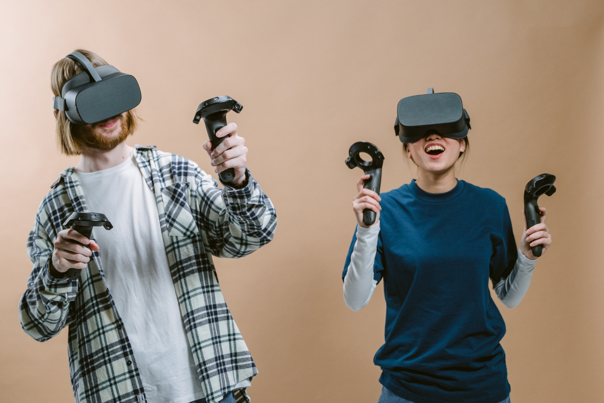 A Man and a Woman Playing a Virtual Reality Game